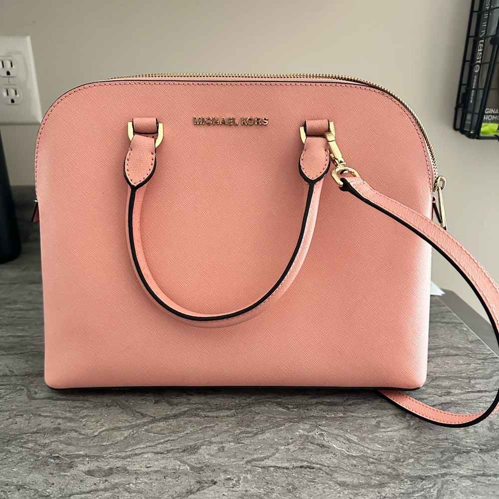 Micheal Kors Pink medium sized purse - handles and adjustable long strap.